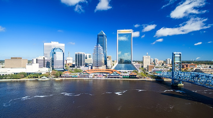 The image of Jacksonville cityscape showing the river and skyscrapers